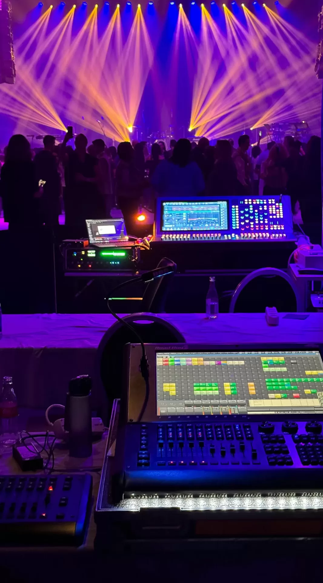 Colorful event lighting beams at a live production